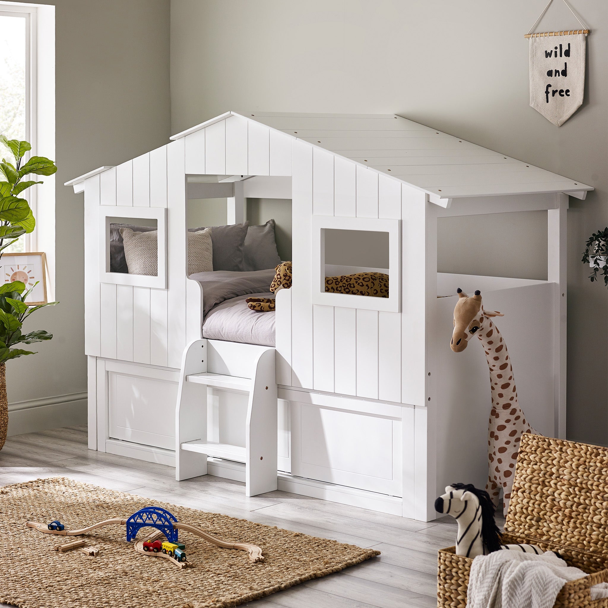 Features an enchanting treehouse-style design. Delightful white panelling and rooftop windows inspire endless imaginative play. Slide-door storage unit underneath provides great storage for toys and books. Easy access with a small step ladder invites endless daydreaming. Inspire daydreams through the roof gap, perfect for gazing out. Dimensions: D:221cm W:123cm H:159cm